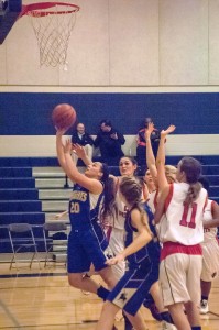 MaryGrace Brittain breaks out of the crowd and takes it to the hoop.