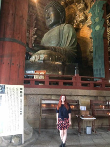 Kayla standing in front of huge bronze statue of the Great Buddha, cast in Nara in AD 749.