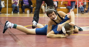 NIcholas Murray prepares to flip his opponent during the TPA-hosted middle school wrestling tournament on Saturday, Dec. 16.