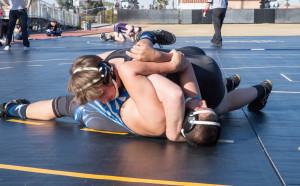 Brendan Phelan prepares to pin his opponent.