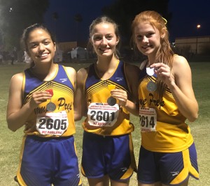 From left, sophomore Jatzia Felix took 2nd place in long jump, sophomore Lauren Casey took 4th place in the 100, and freshman Allie Youngs took 3rd place in high jump.