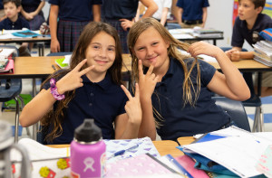 Sixth graders Lilly Henderson, left, and Autumn Evdokimo seem to like their new school!