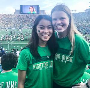 Rachel, left, enjoys a Notre Dame football game with a friend.