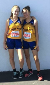 Sophomores Kylie Klassen, left, and Sama Allam at the State Cross Country meet.