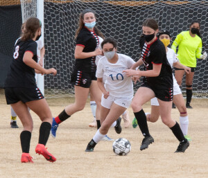Cienna Jaime dribbles around an opponent.